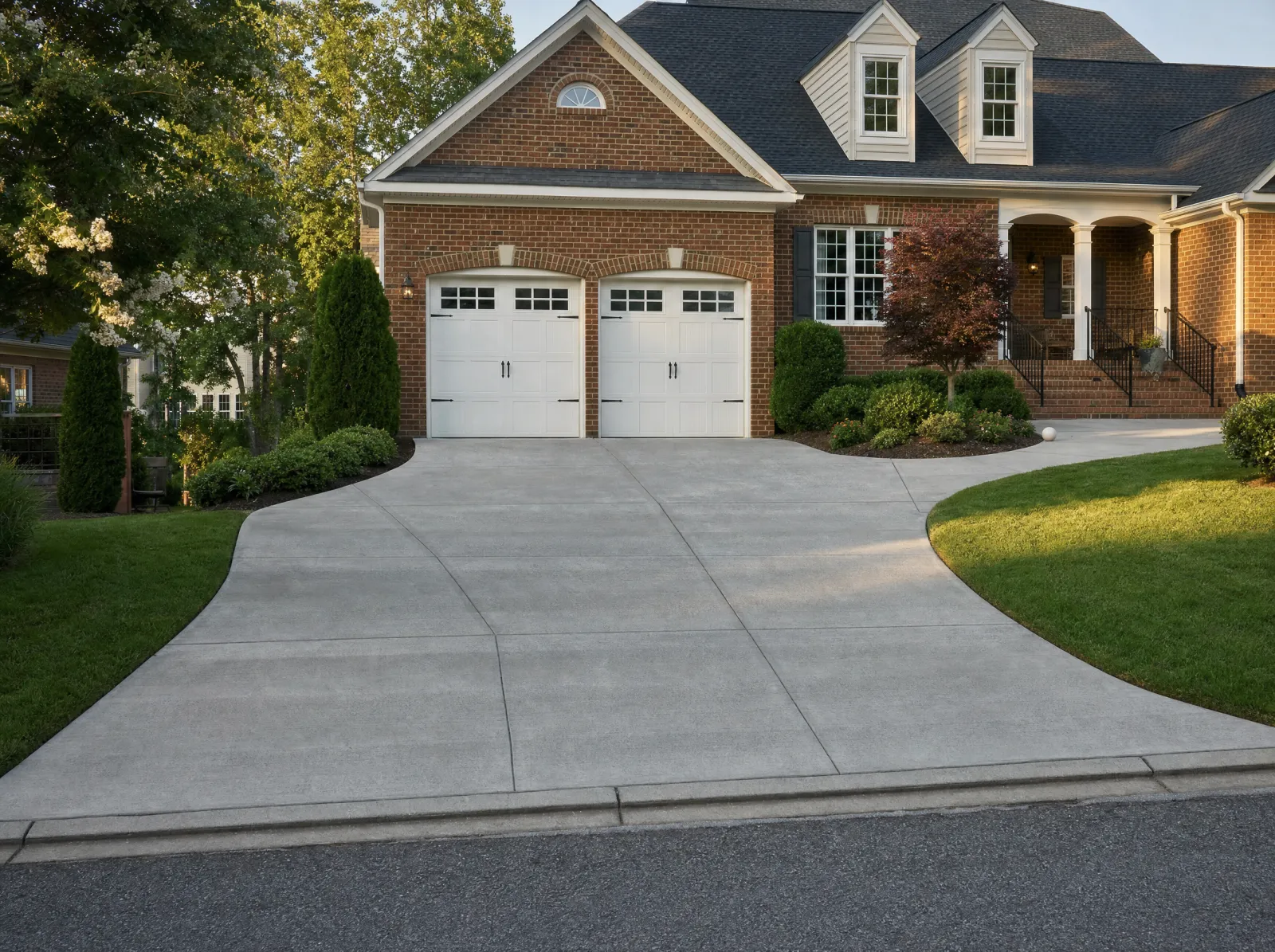 Design concept: New two-car broom-finish driveway with apron, from the street.