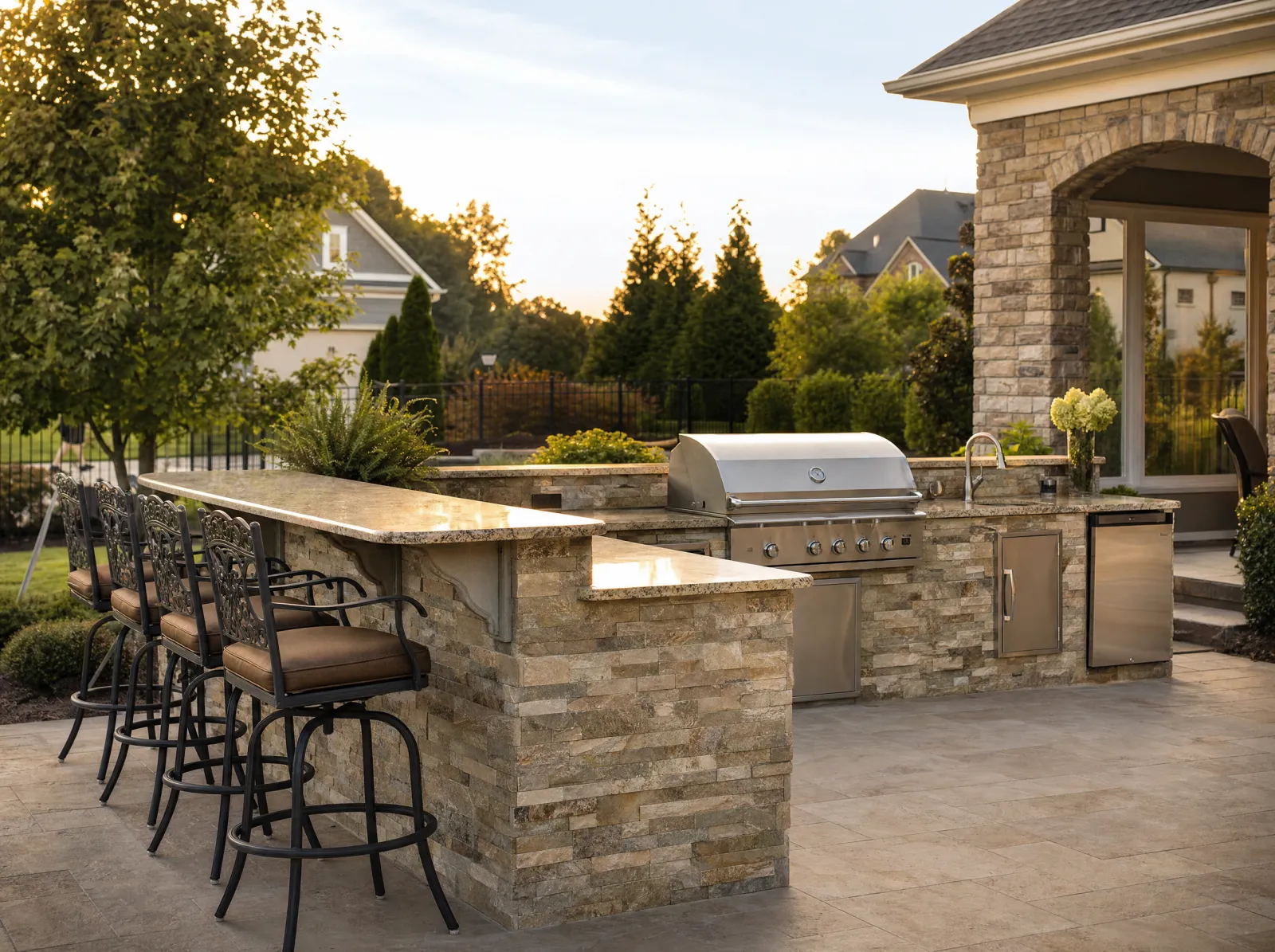 Design concept: Outdoor kitchen island with stone veneer and grill, side view.