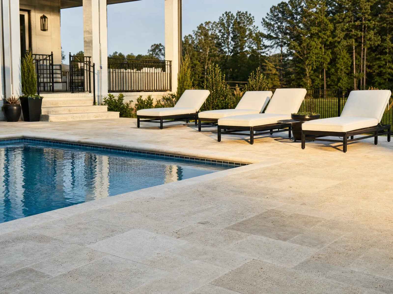 Design concept: Travertine pool surround with bullnose coping, water in frame.