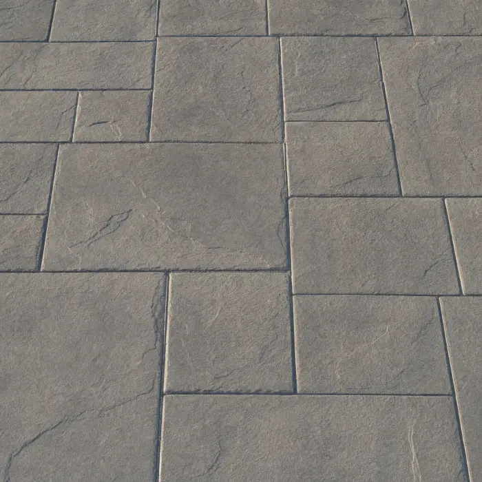 Design concept: stamped concrete in a slate-texture ashlar pattern with charcoal release colour in the joints.