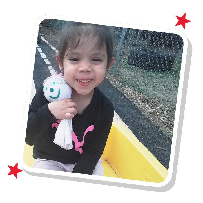 Preschool child playing and learning at Magic Kingdom Learning Center, developing language and social skills in Harlingen TX