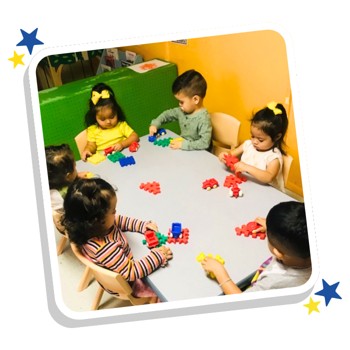 Children playing with building blocks during hands-on learning activity at Magic Kingdom Learning Center in Harlingen TX