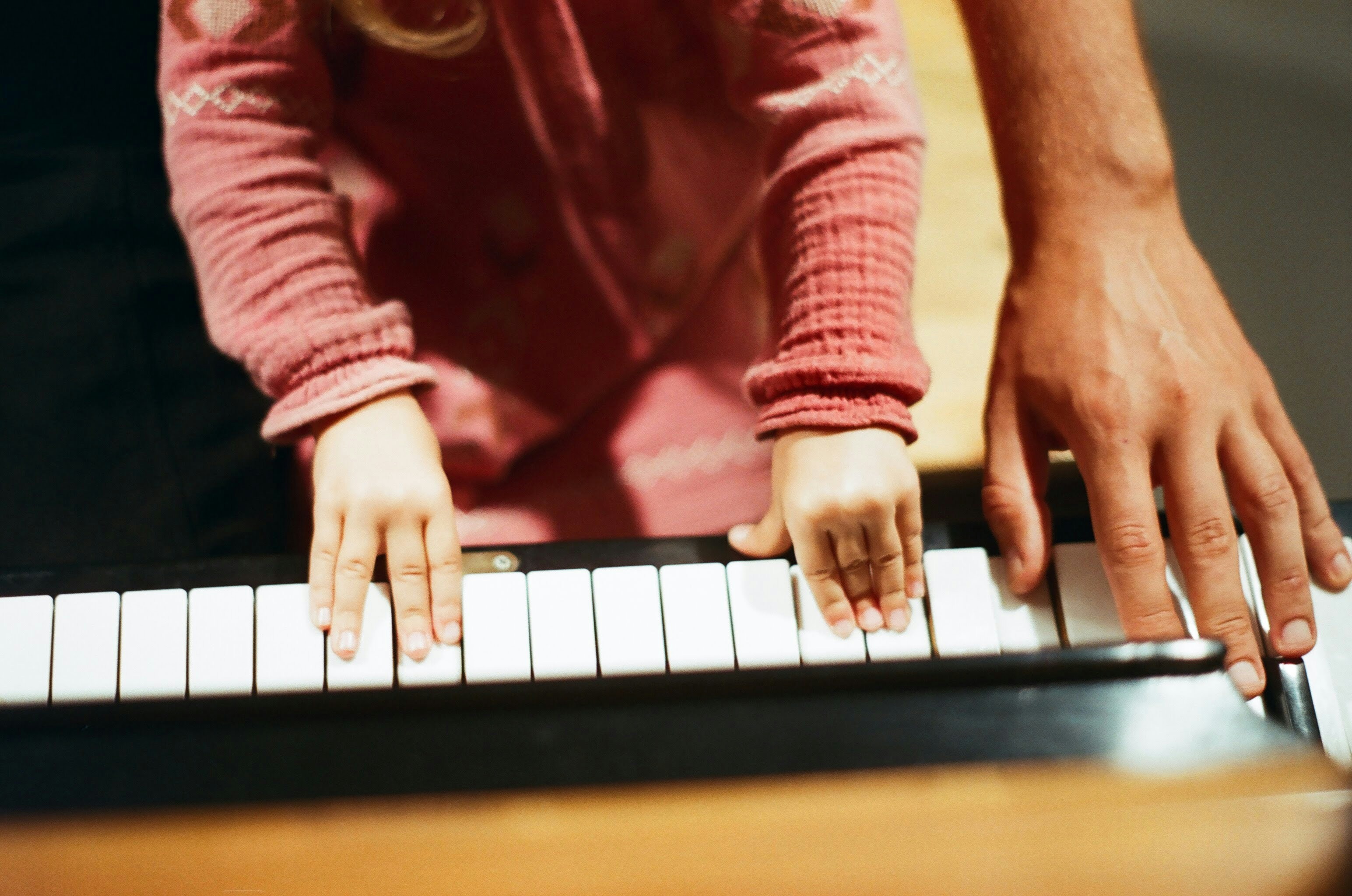 a kid using a piano a kid using a piano