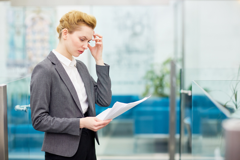 woman concentrating on some documents