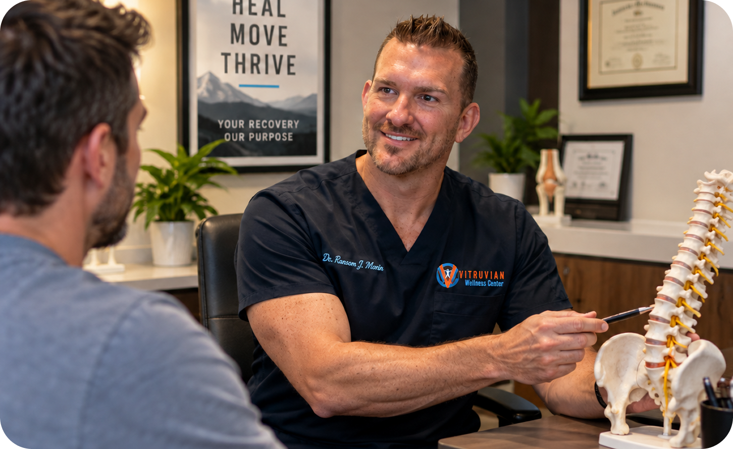 Dr. Ransom J. Morin explaining a spine model to a patient