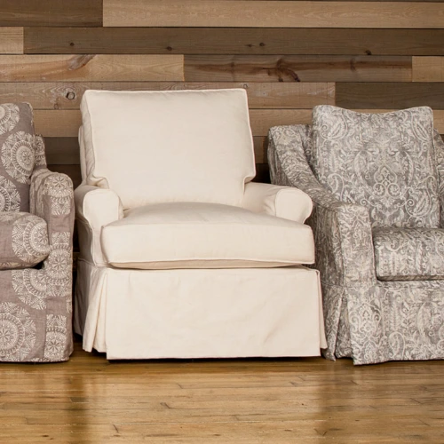 Slipcovered accent chairs and ottomans