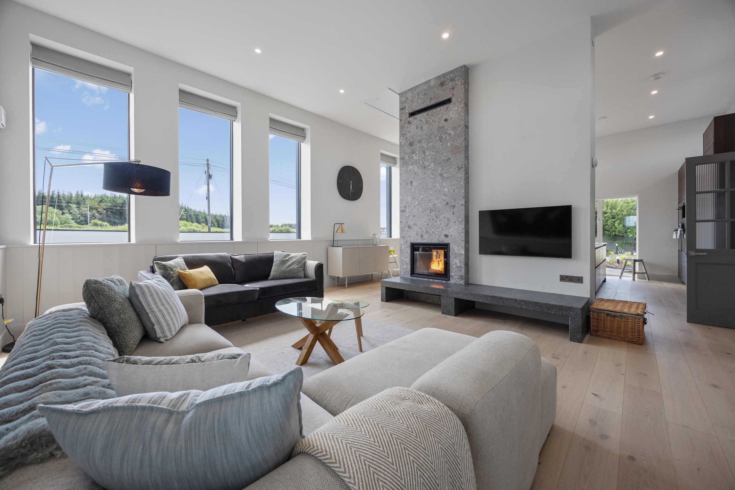 Sitting room with fireplace at The Schoolhouse, Tullycrine