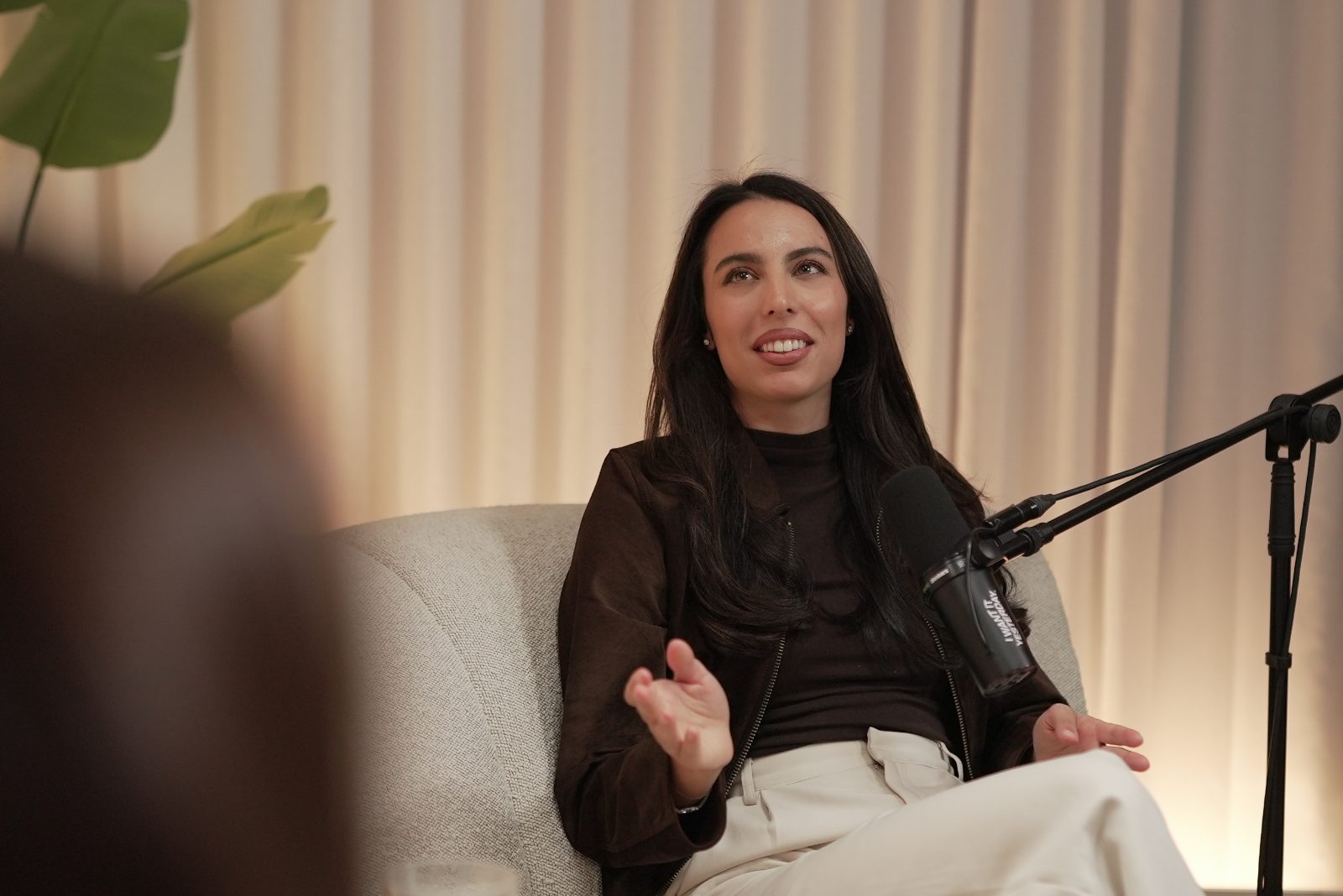 Erika talking with a guest during a recording