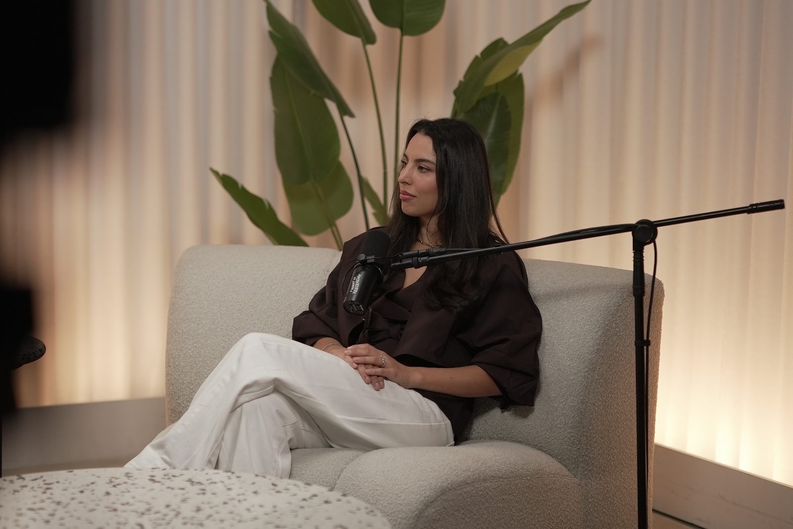 Erika listening to a guest in the studio