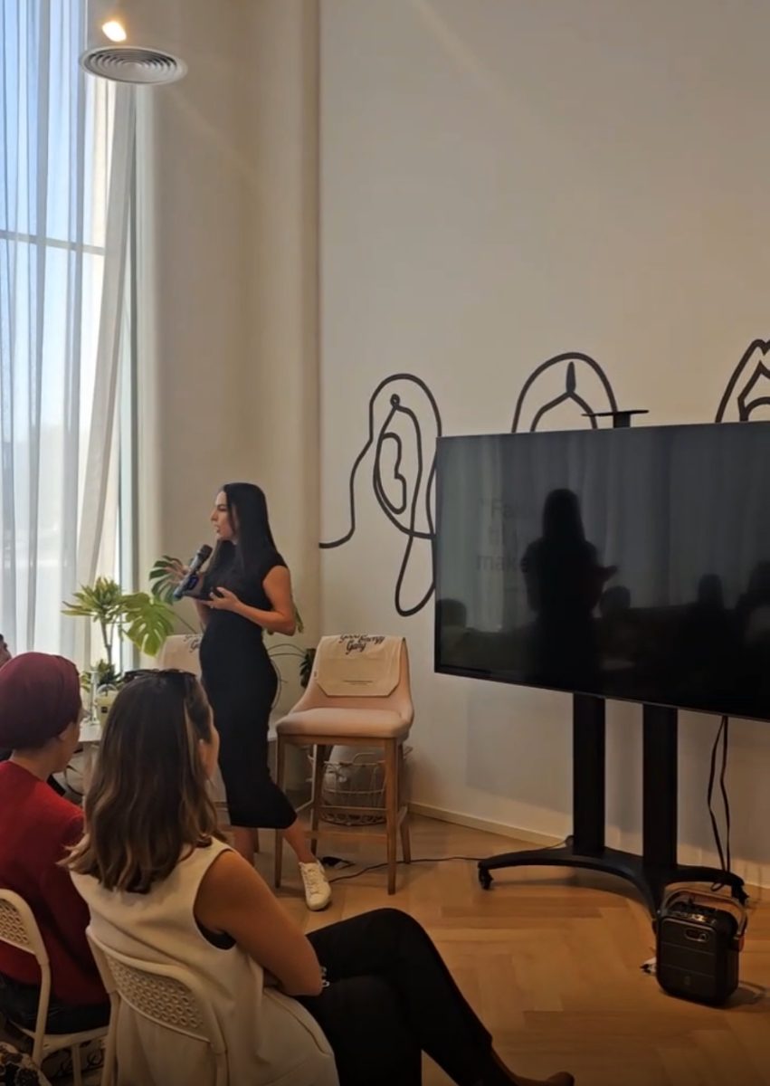 Erika speaking to a group at The Bureau, Dubai