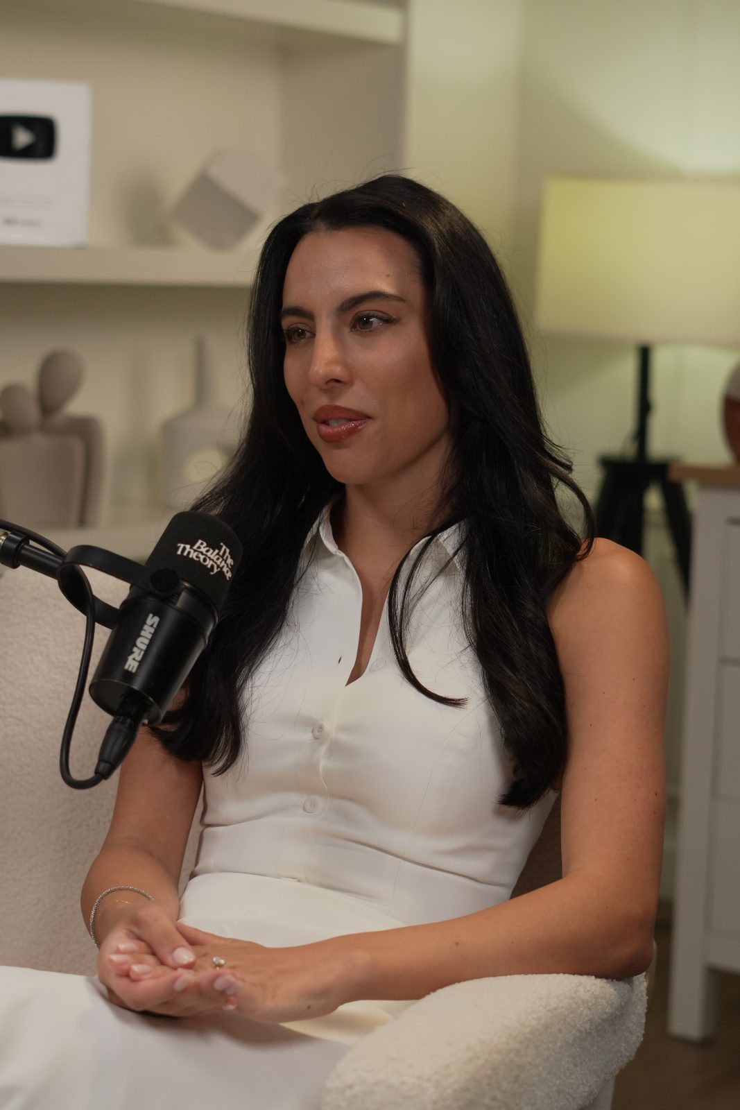 Erika mid-conversation at the microphone