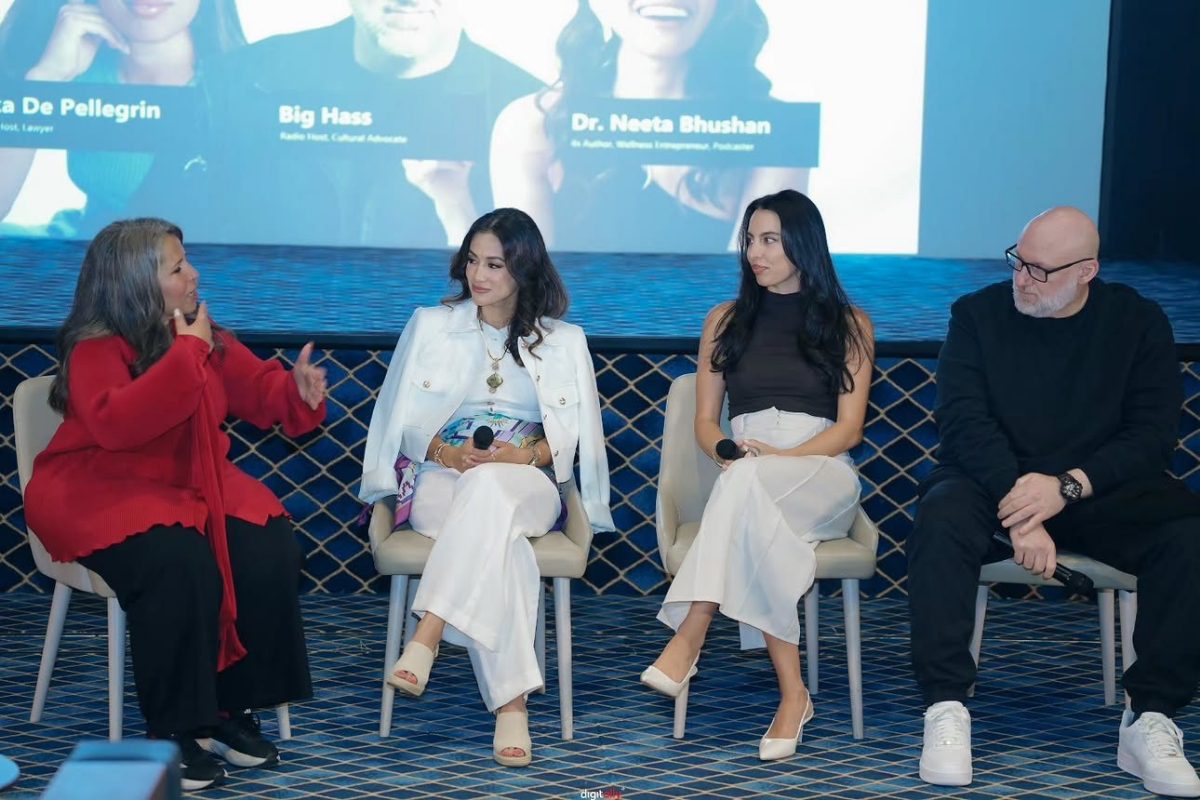 Erika seated on a panel at Mission Visible's Open Day