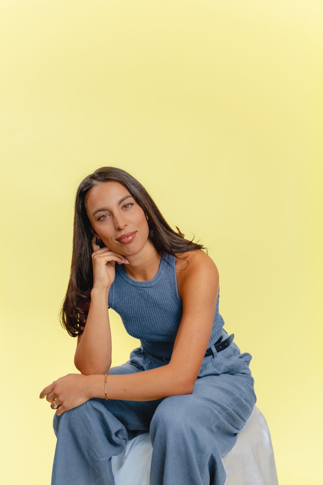 Portrait of Erika against a yellow backdrop