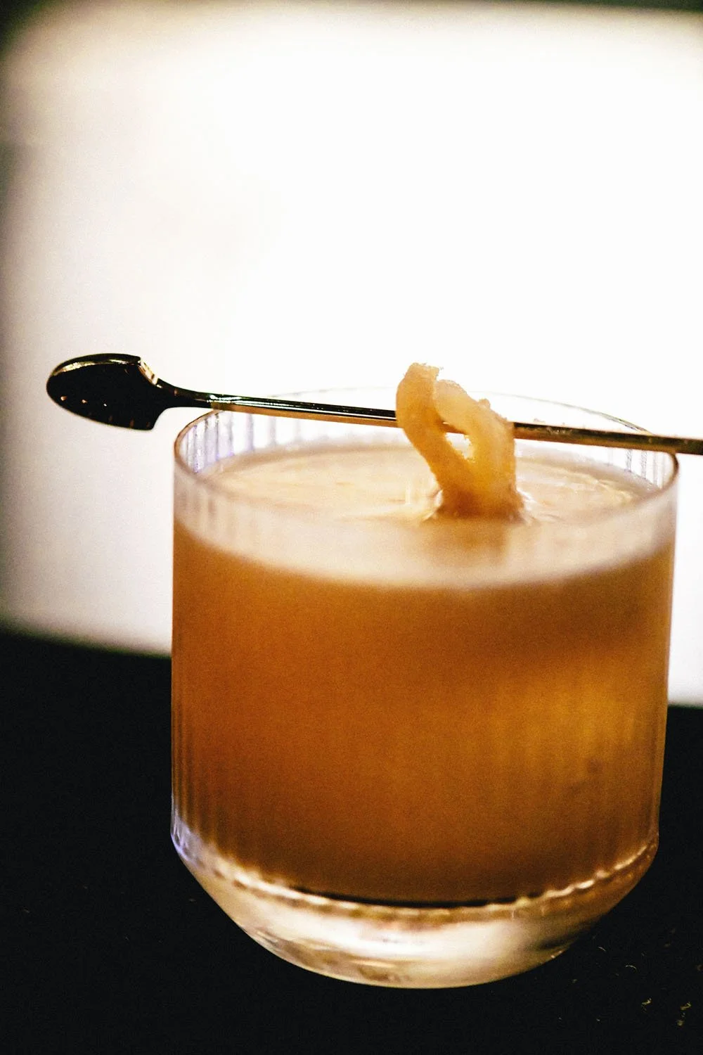A backlit whiskey sour