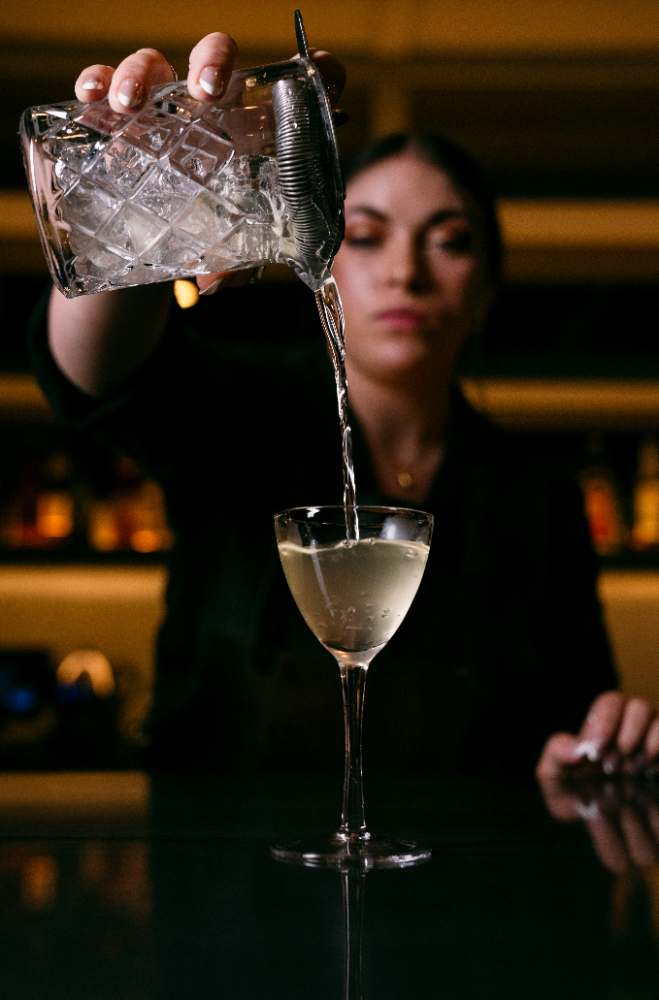 Pouring a chilled martini at the rail