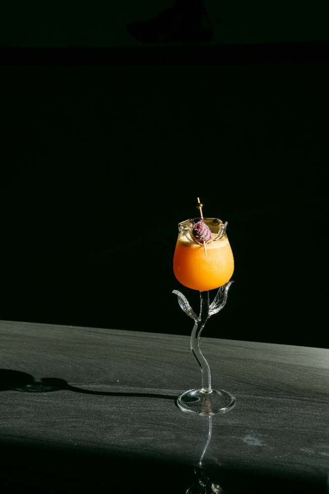 A rose-stem cocktail catching the light