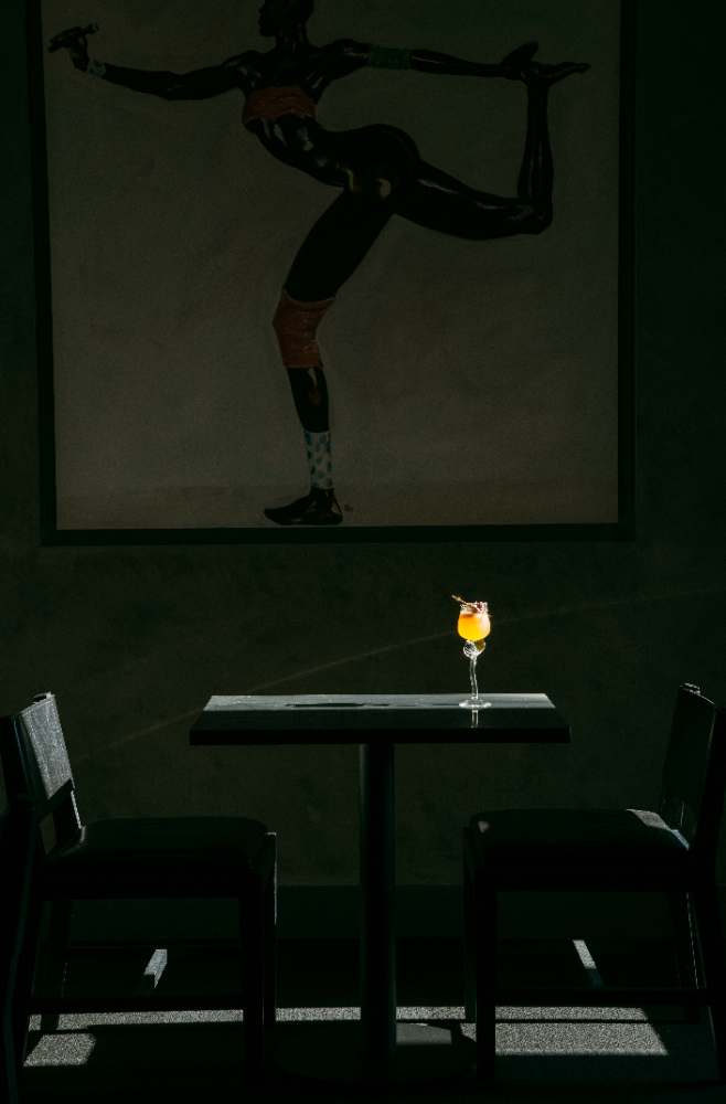 A quiet table beneath the art