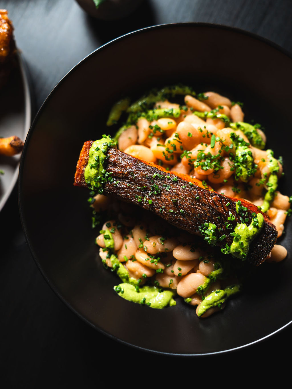 Seared salmon over butter beans