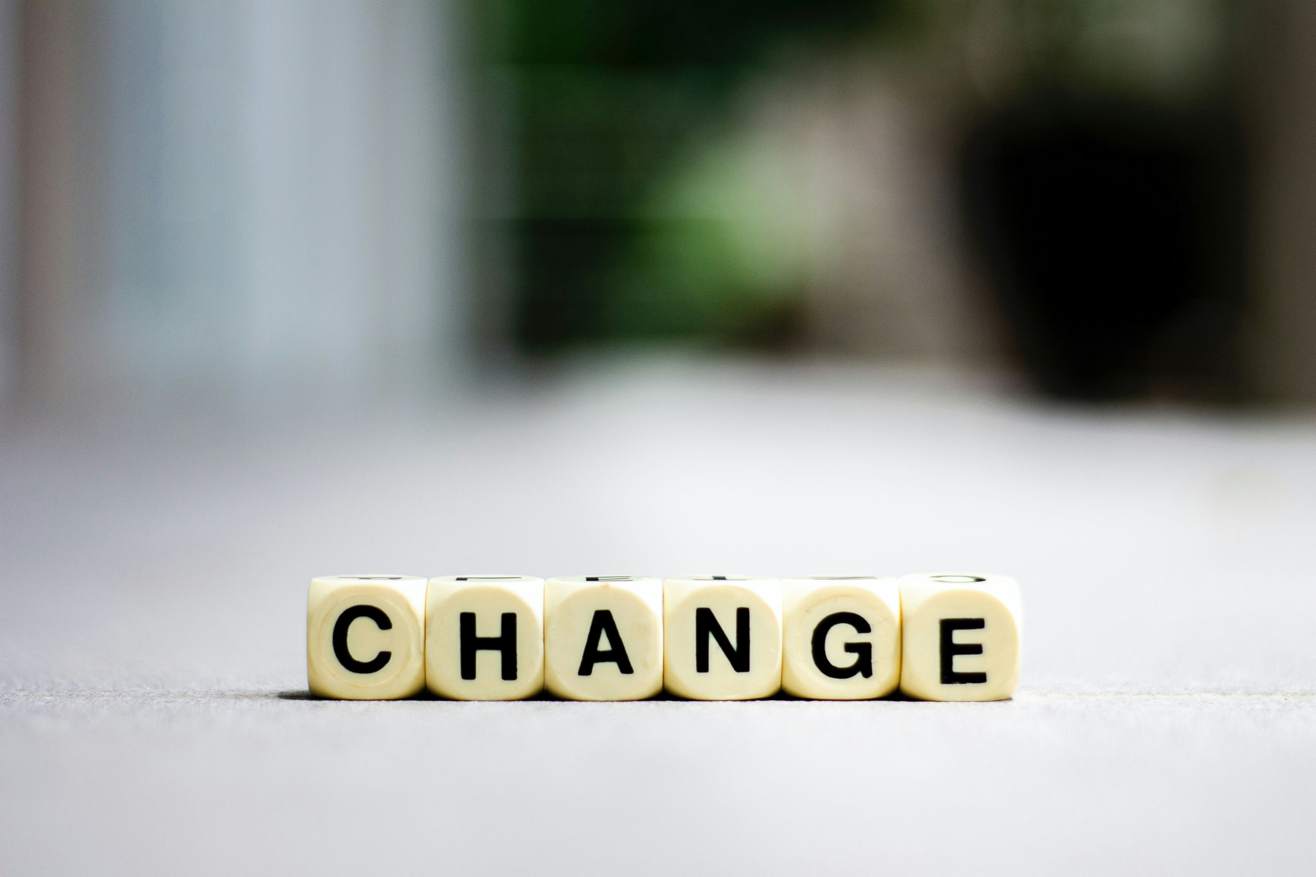 Scrabble tiles spelling the word “change”, representing workplace and organisational change.