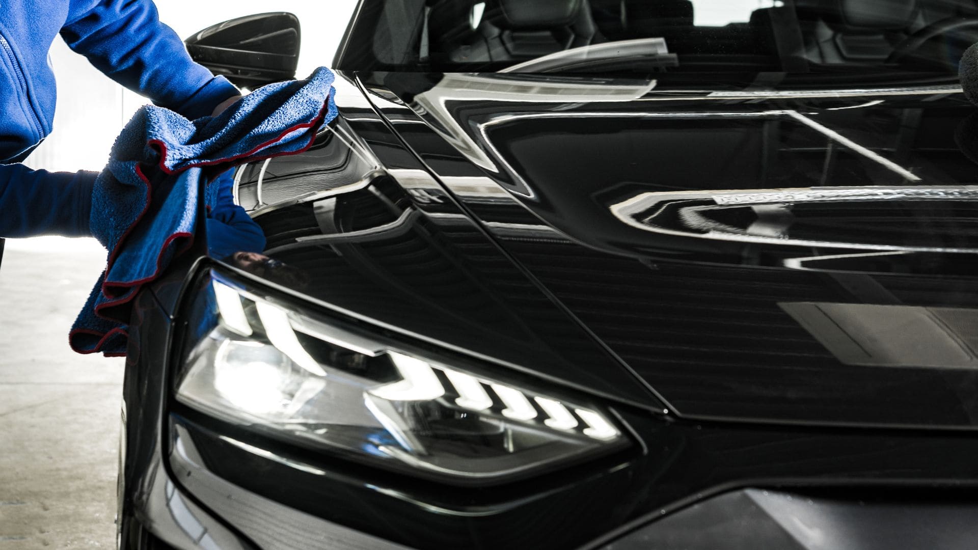 PPF application by gloved hands protecting vehicle paint