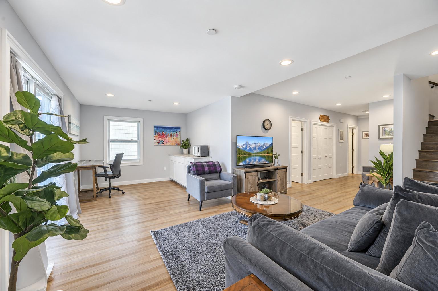 Expansive first-level living area with bamboo floors and a wet-bar nook
