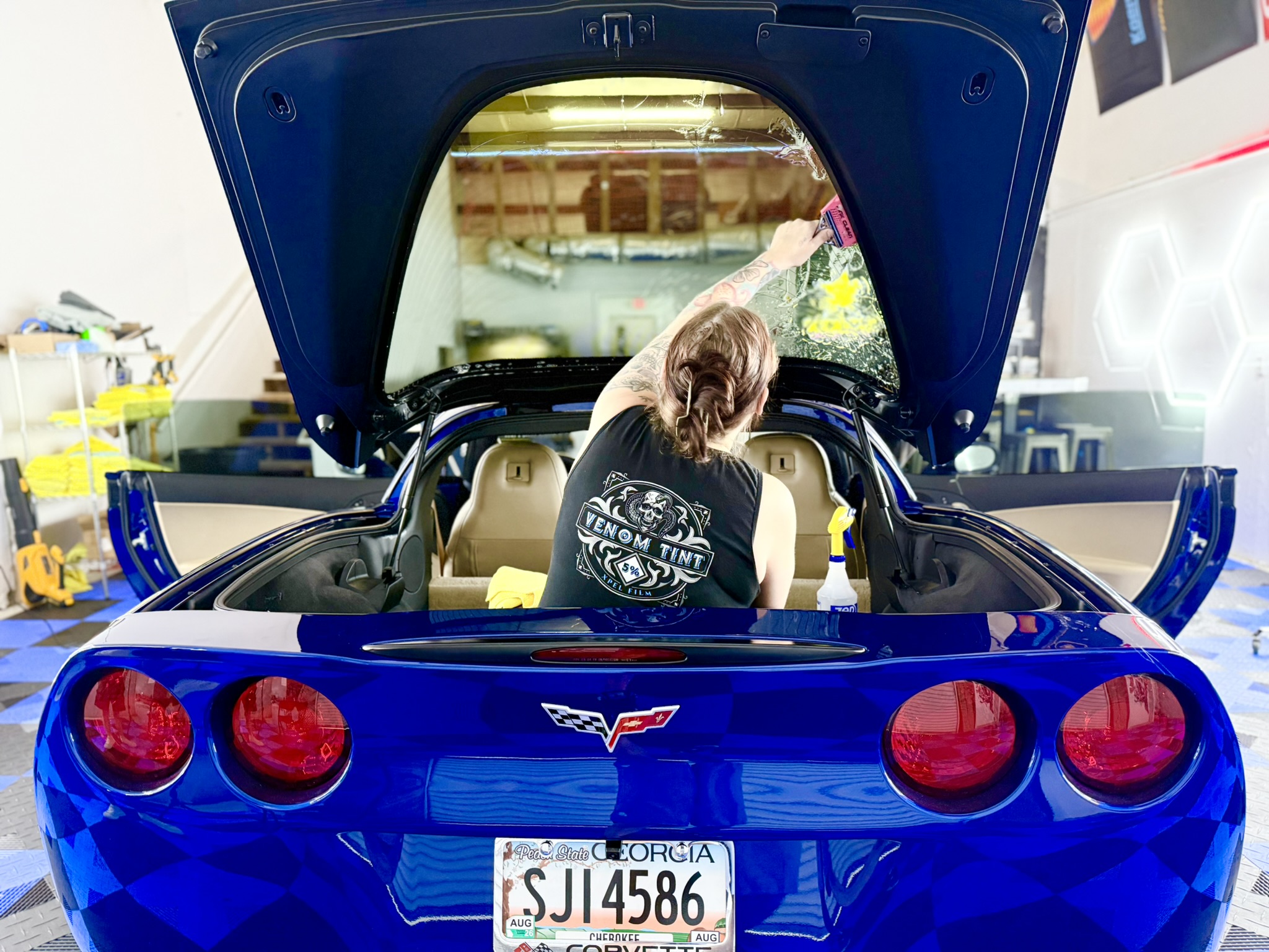 Venom Tint Acworth owner professionally installing automotive window tint in Acworth GA