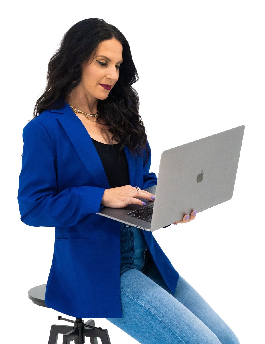 Adrienne Dorison working at a laptop