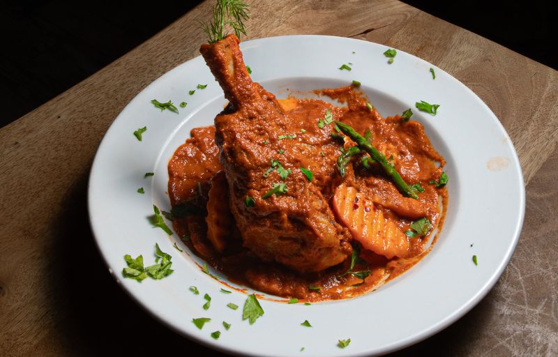 Lamb Kleftiko — slow-roasted lamb shank with tomato sauce, vegetables and mash at Mosaic Braintree