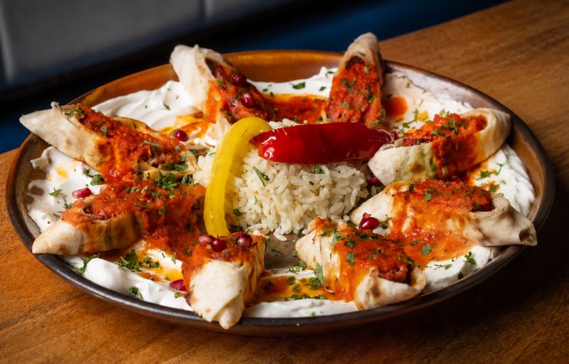 Lamb Sarma Beyti — lavash-wrapped lamb with yoghurt and tomato butter sauce at Mosaic Braintree