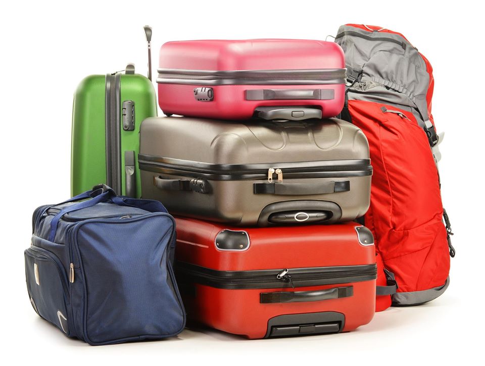 Travel luggage stacked and ready for an airport ride
