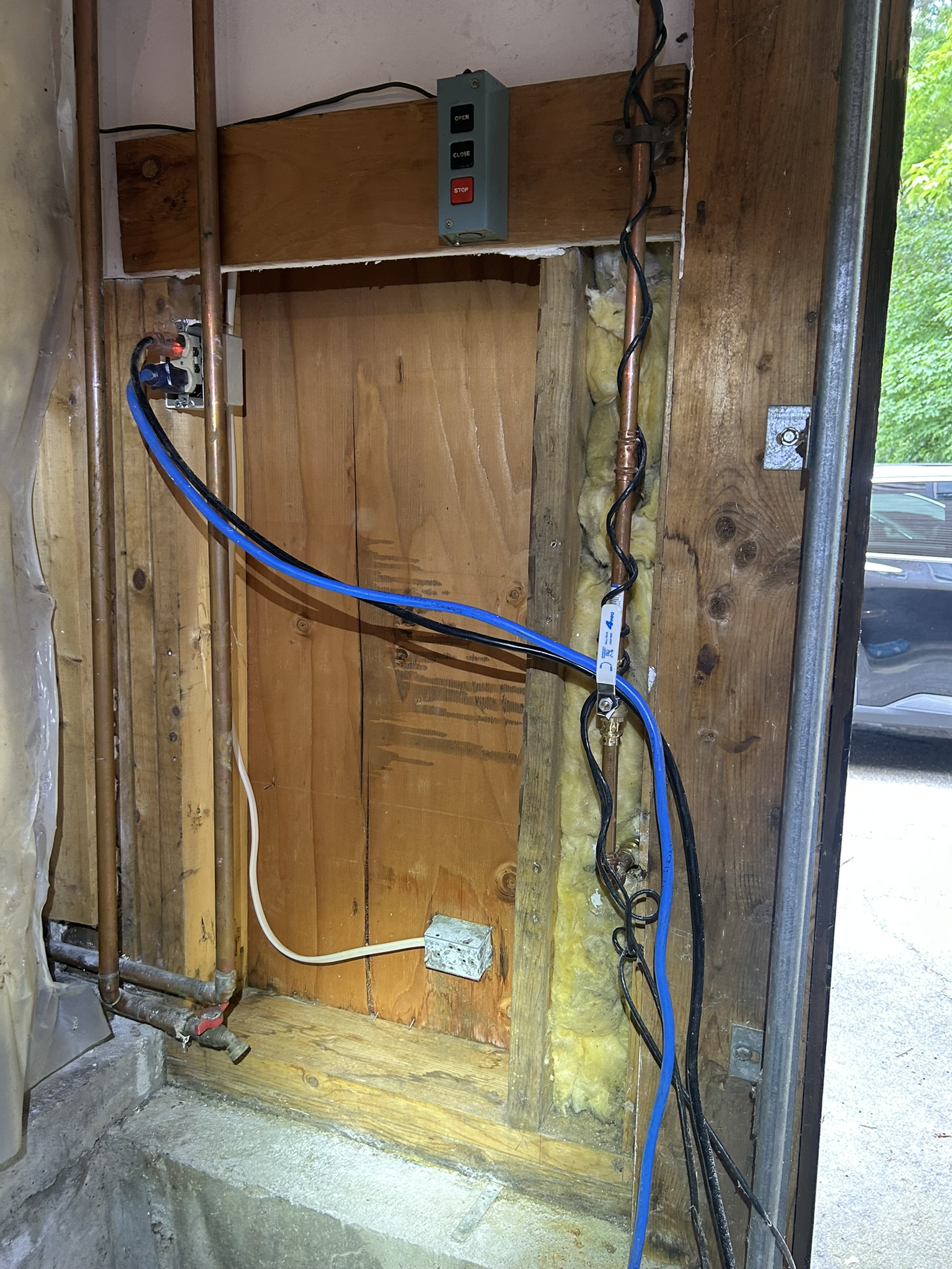 Hampstead garage after: damaged drywall removed, framing cleaned