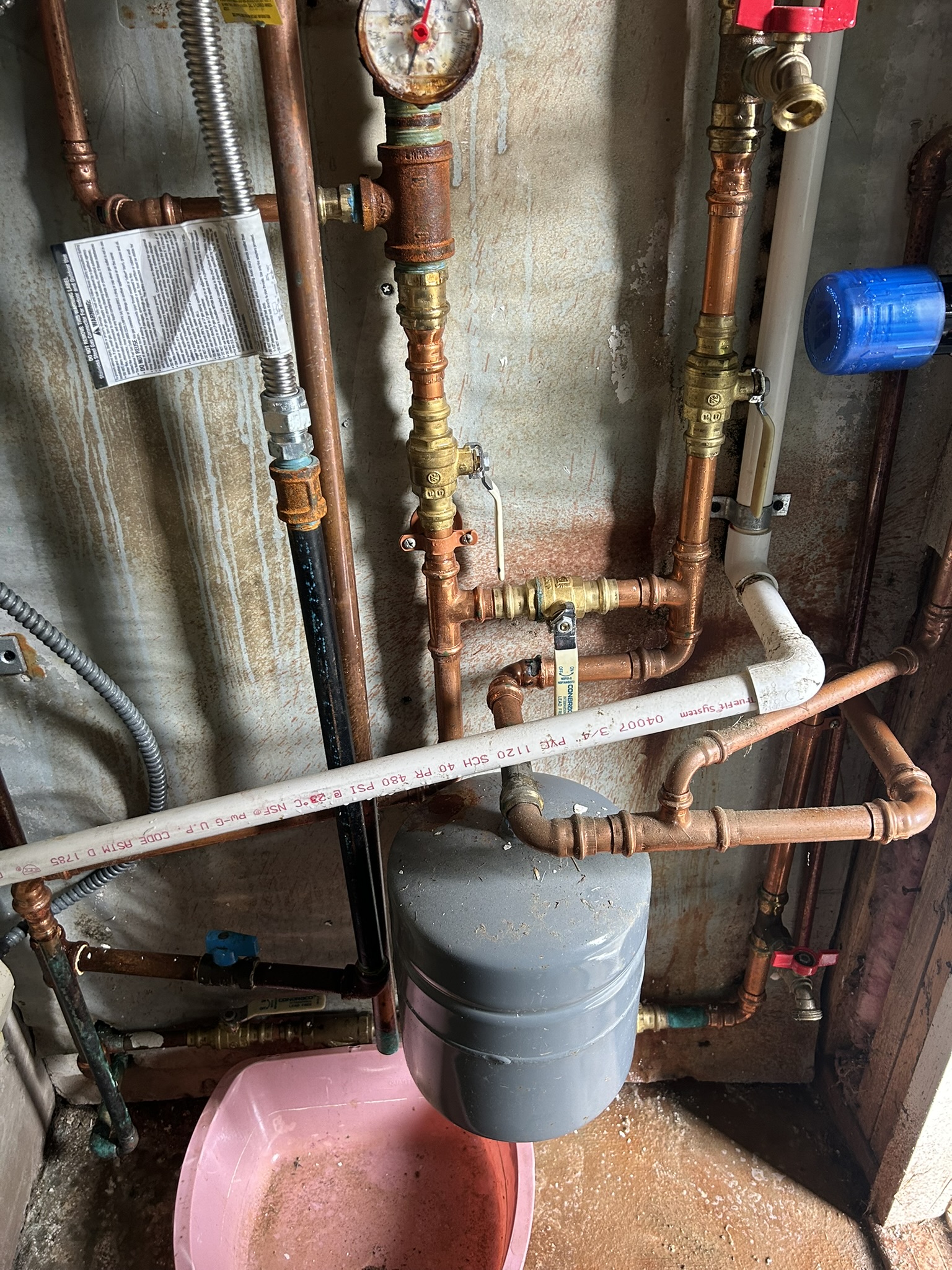 Nashua utility room after: corner by heating pipes cleaned