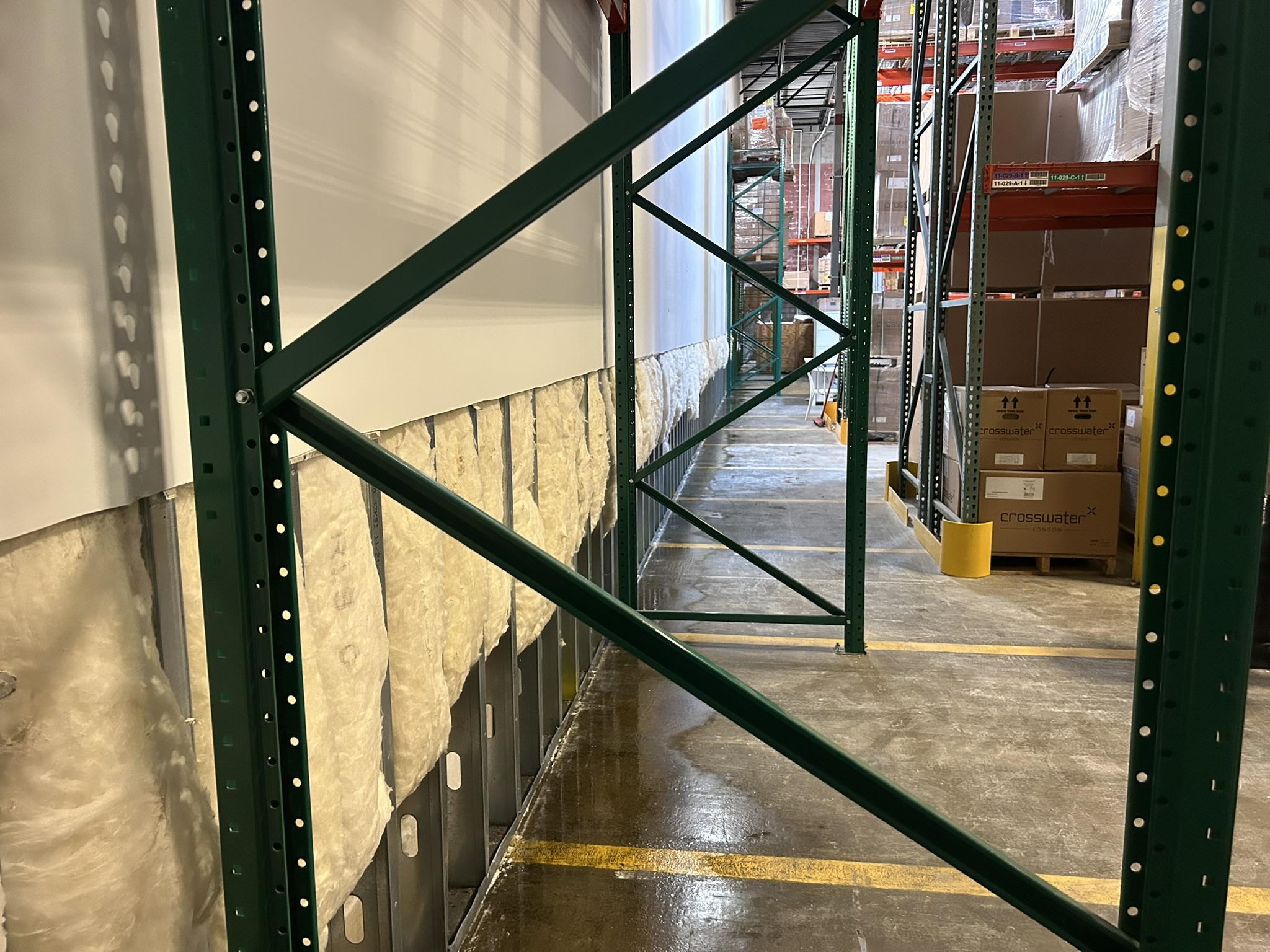 Milford MA commercial property: damaged drywall removed along the prep area wall