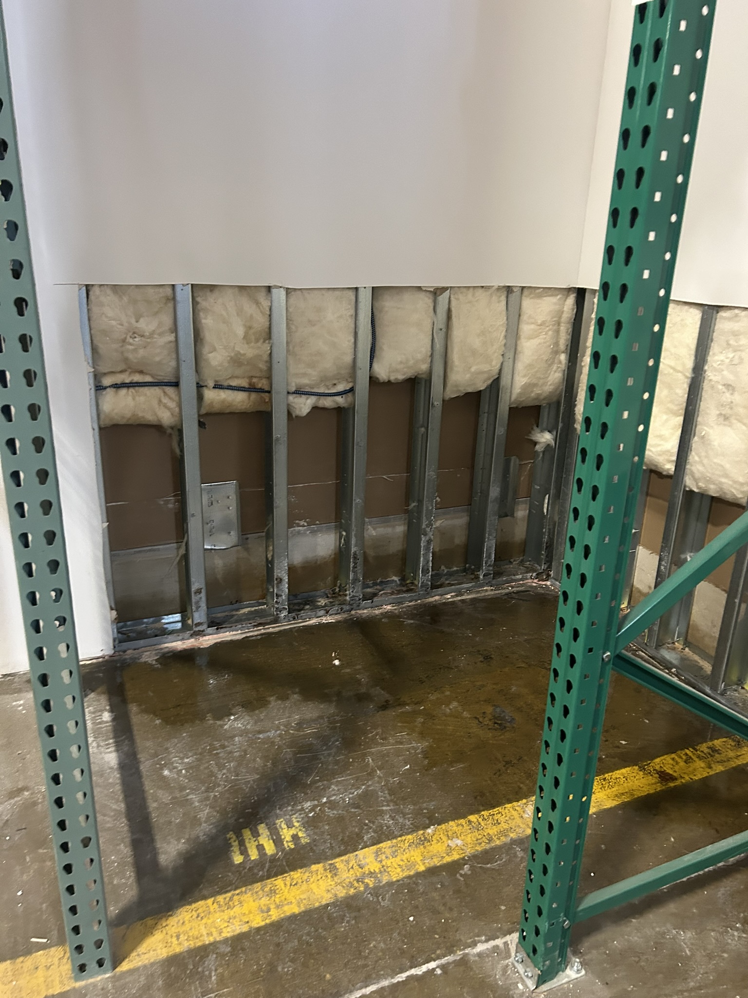 Milford MA commercial property: wall opened and cleaned after drywall removal