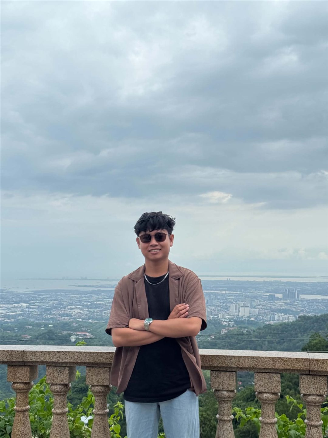 Josh standing at a city overlook