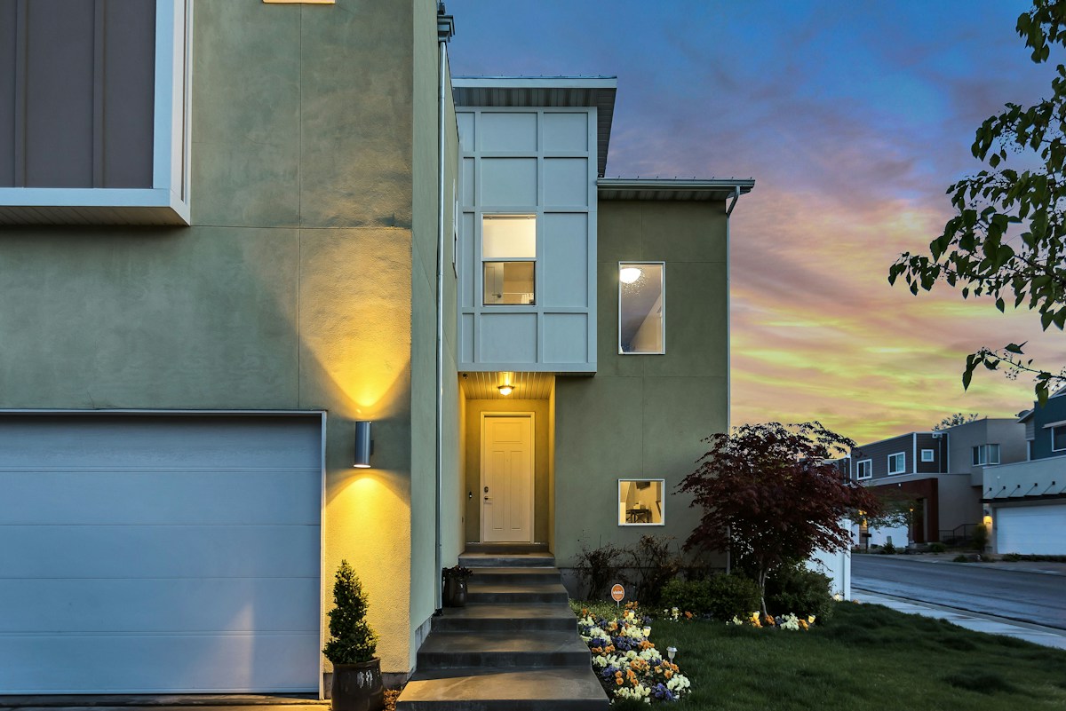 Modern two-story home at dusk, 8 Harbor Row