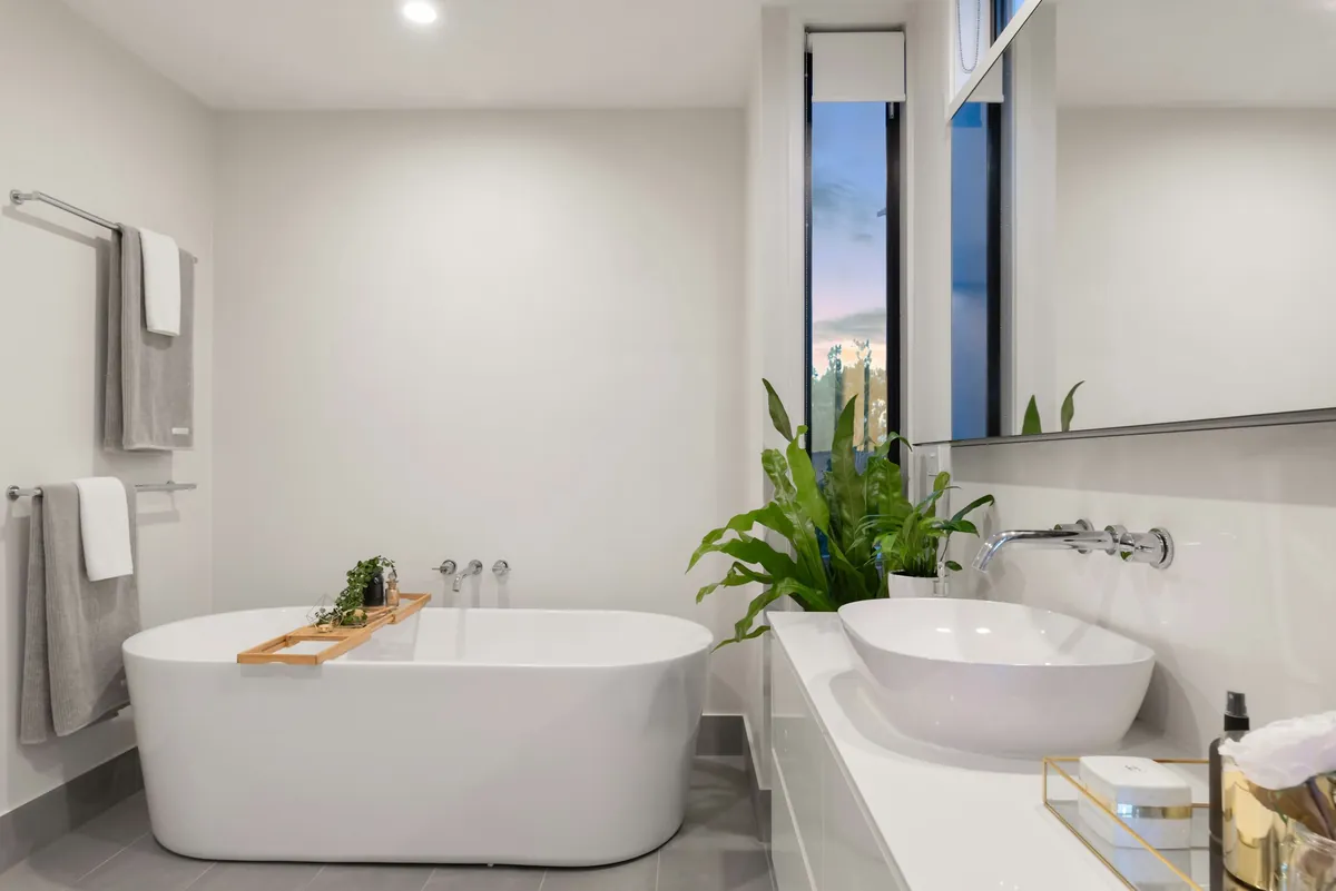 Modern bathroom with a freestanding bath and twin basins