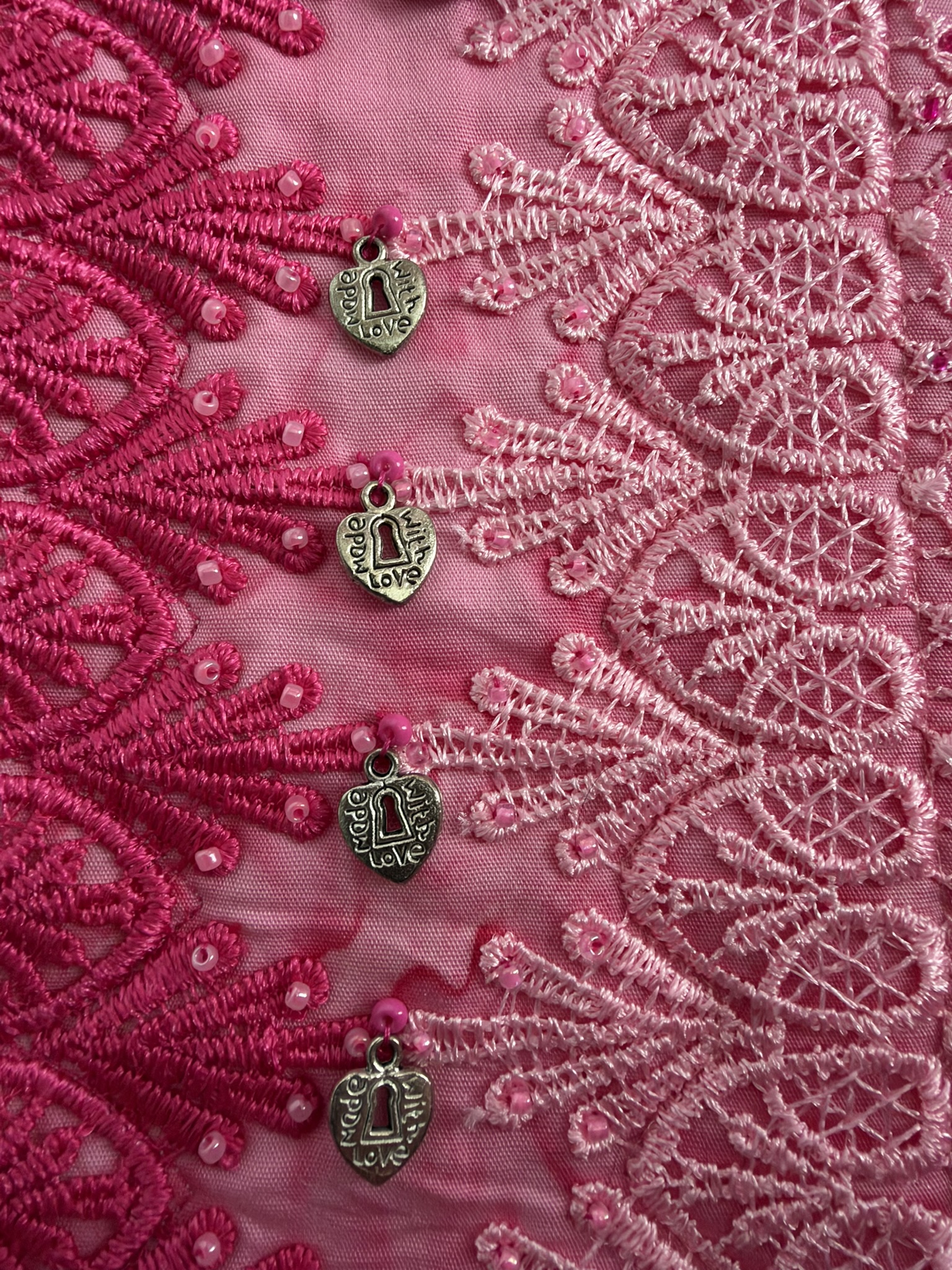 Two lace trims with beads and silver heart charms