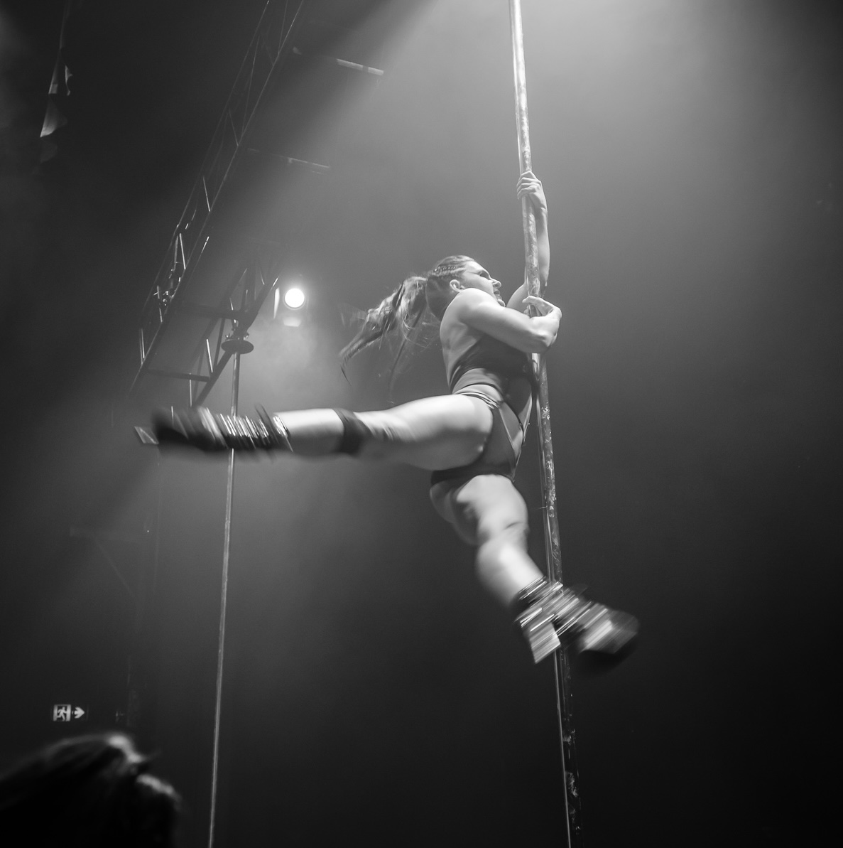 Andrea Ryff in a black and white pole performance shot