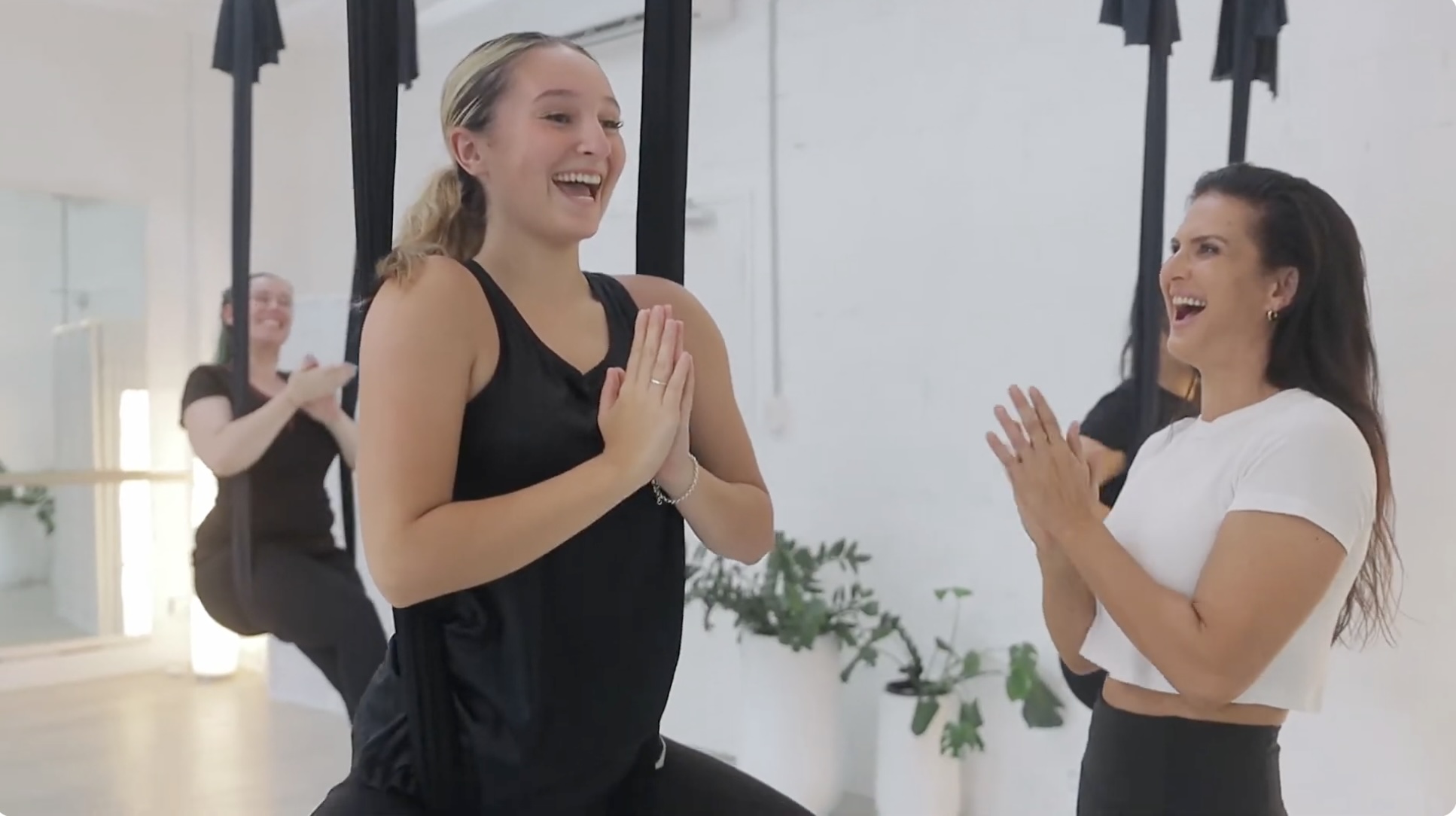 Andrea Ryff teaching an aerial hammock class