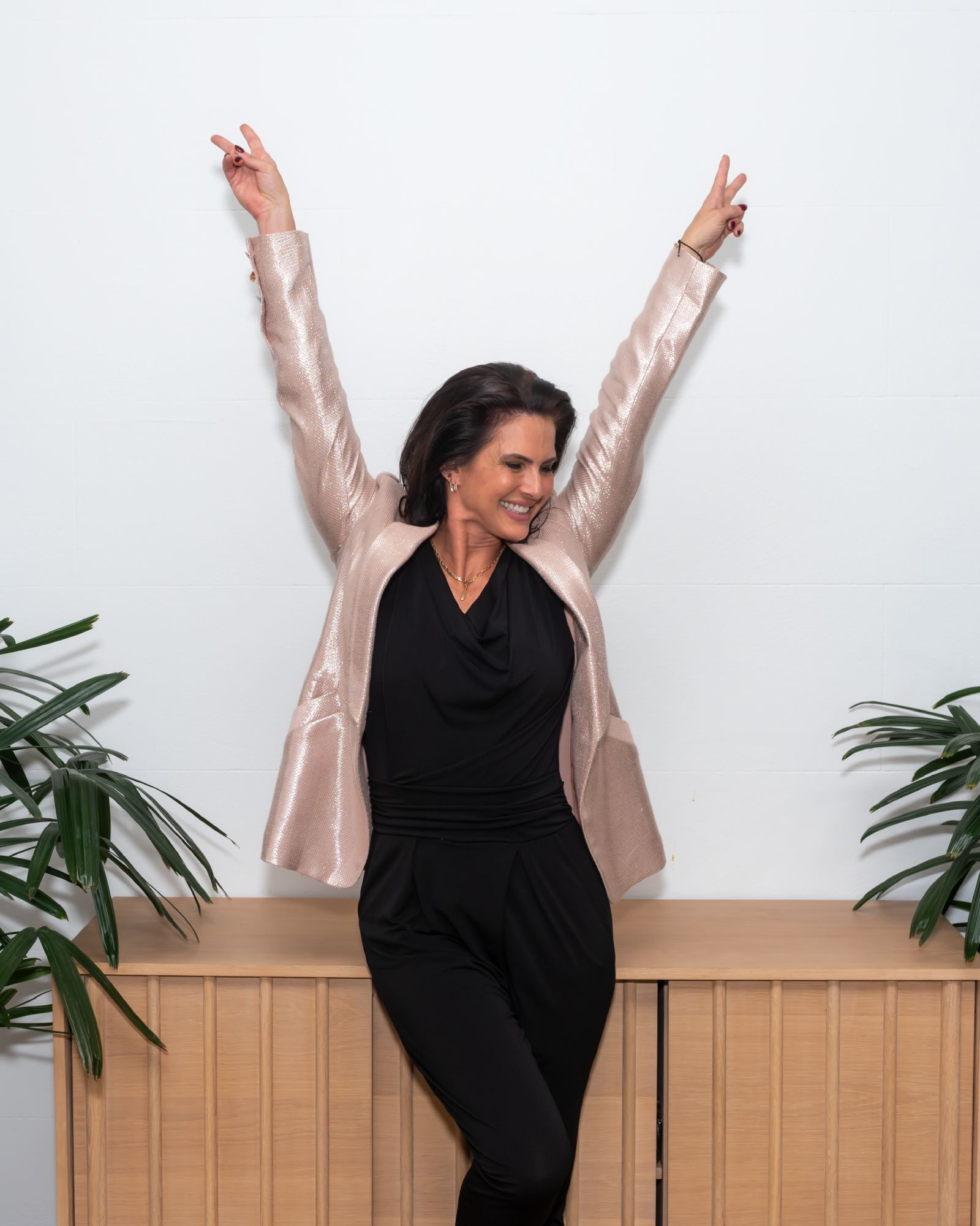 Andrea Ryff with arms raised, celebrating