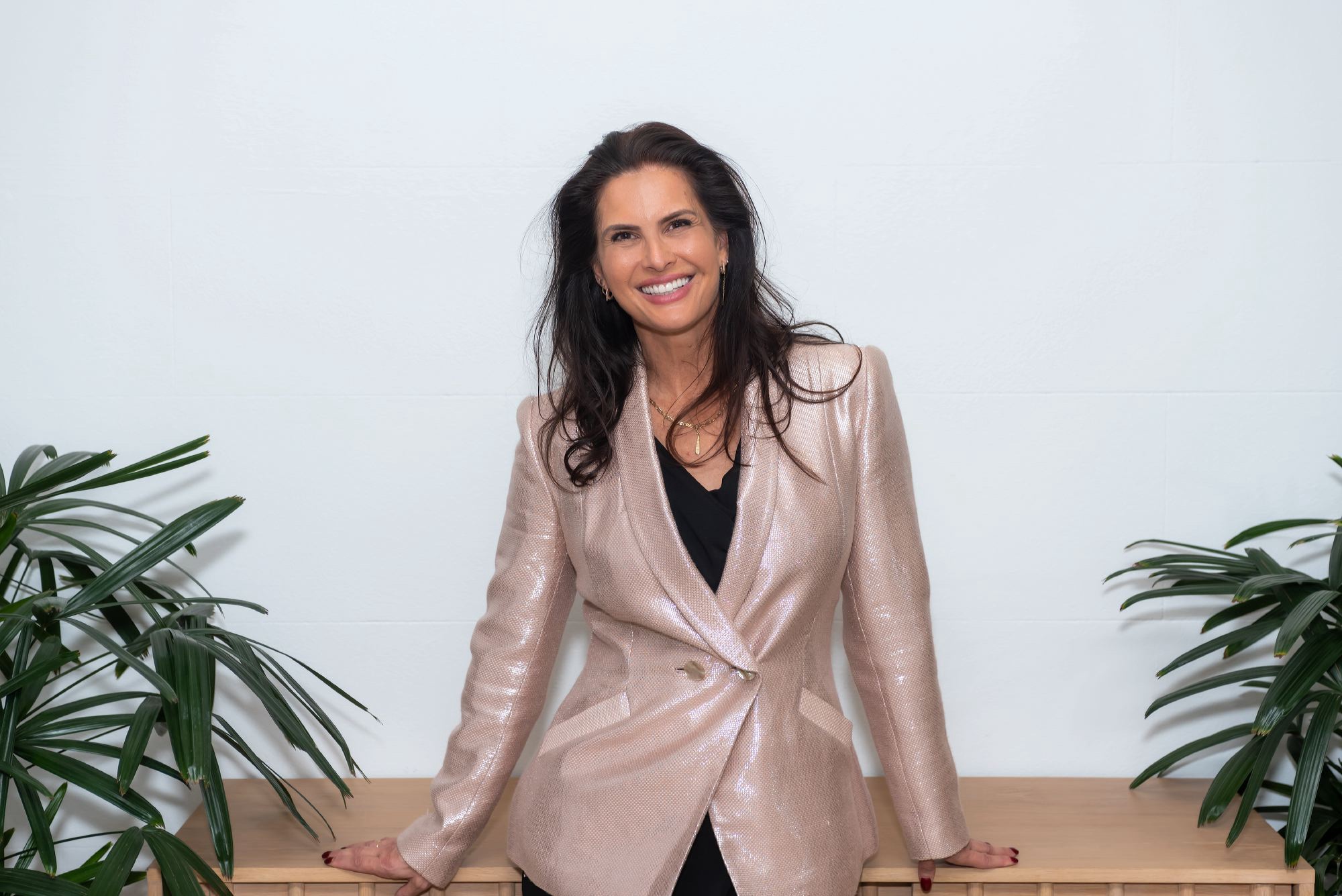 Andrea Ryff smiling in a blush blazer
