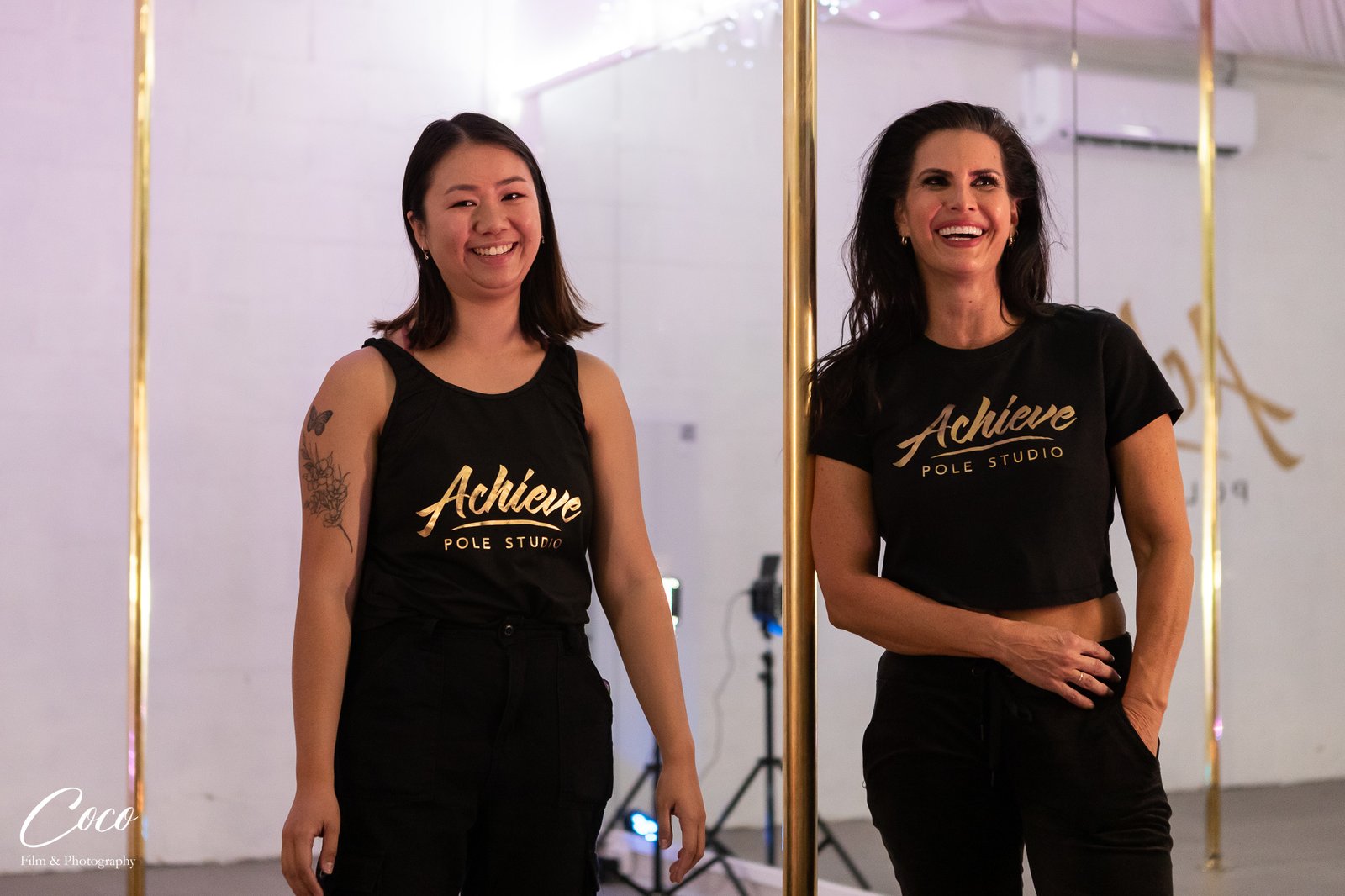 Andrea Ryff with a team member at Achieve Pole Studio
