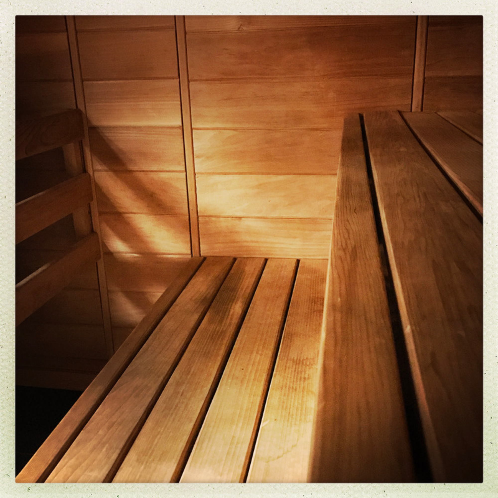 Woman relaxing in indoor sauna
