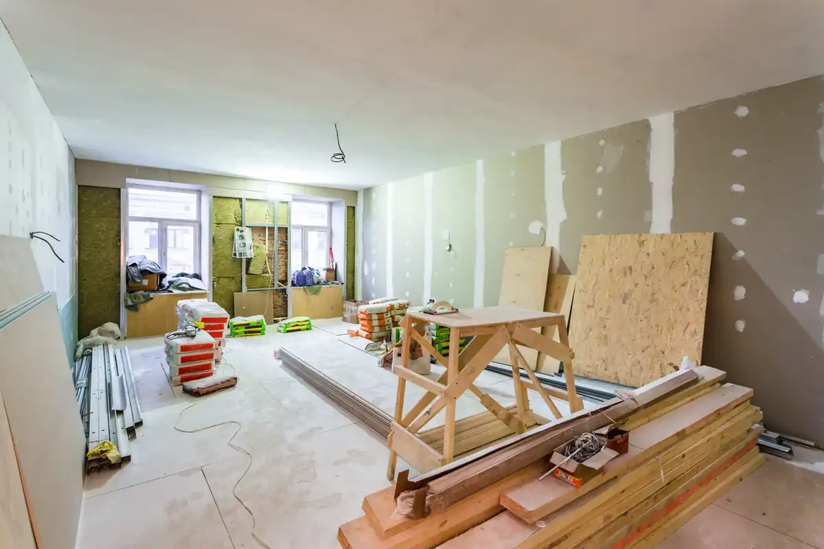 Remodeling project underway with framing and subfloor exposed before finishing