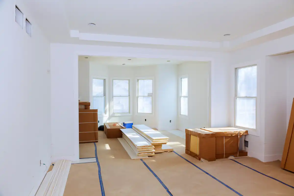 Bright finished interior with taped-off trim and tools set aside