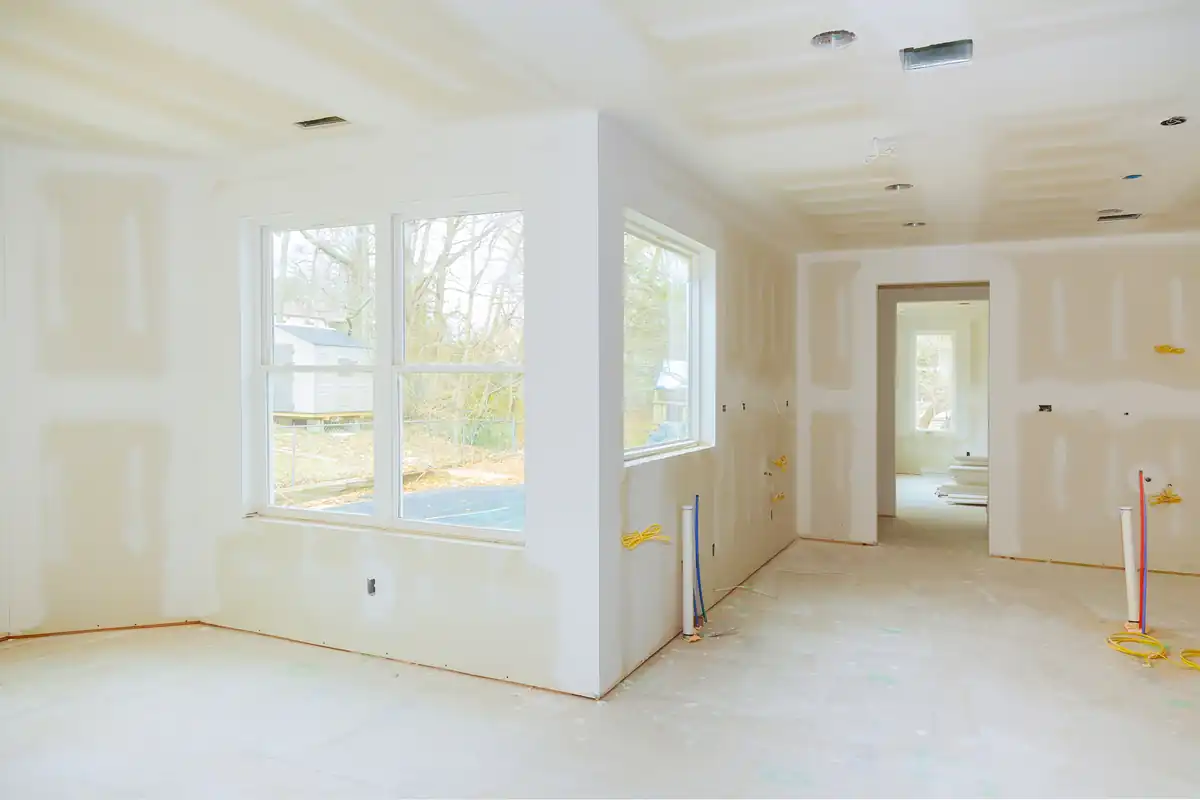 Drywall repair work being finished on an interior wall