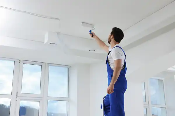 Professional house painters completing an interior painting project
