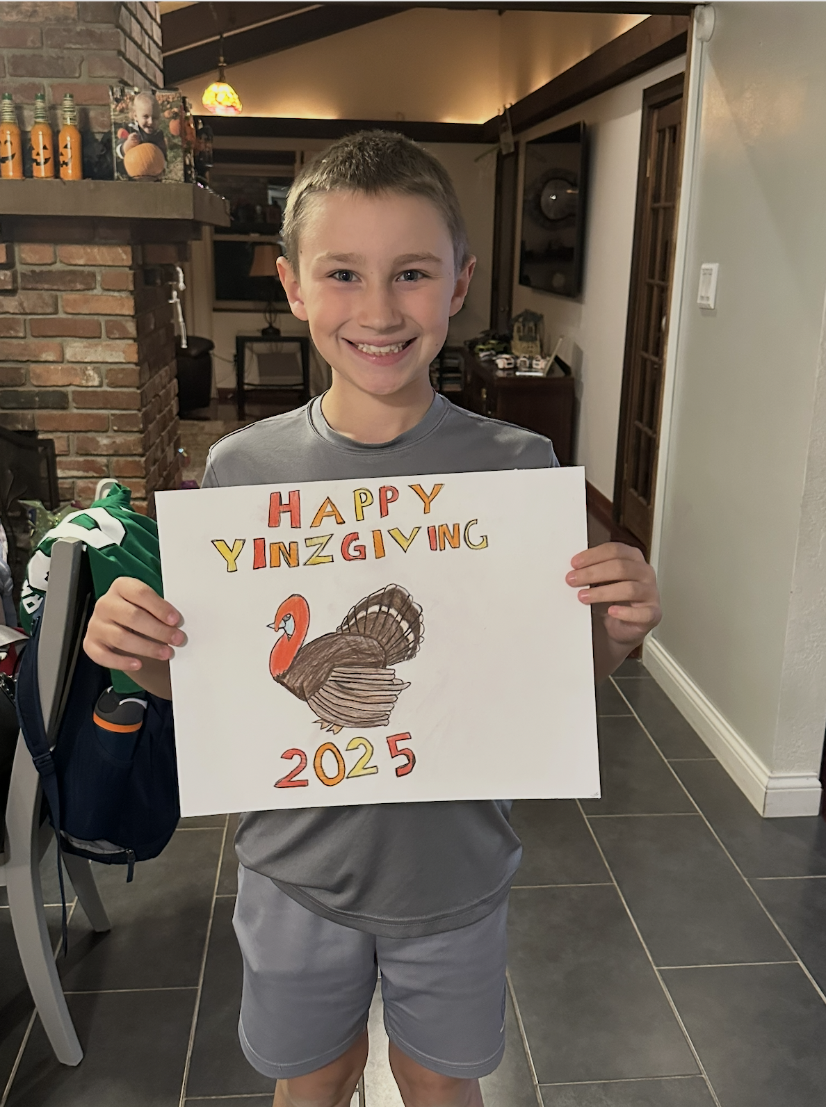 Colt, a fourth grader at Montour Elementary, holding his hand-drawn Happy YINZgiving 2025 turkey