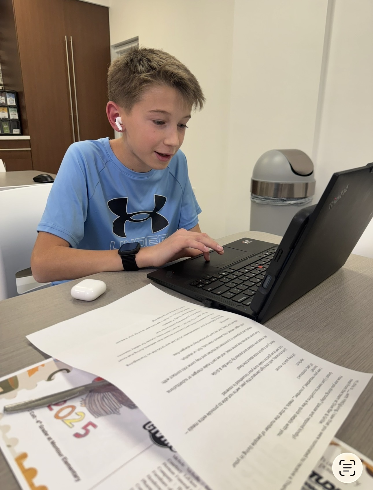 A young volunteer making calls to confirm meal recipient addresses